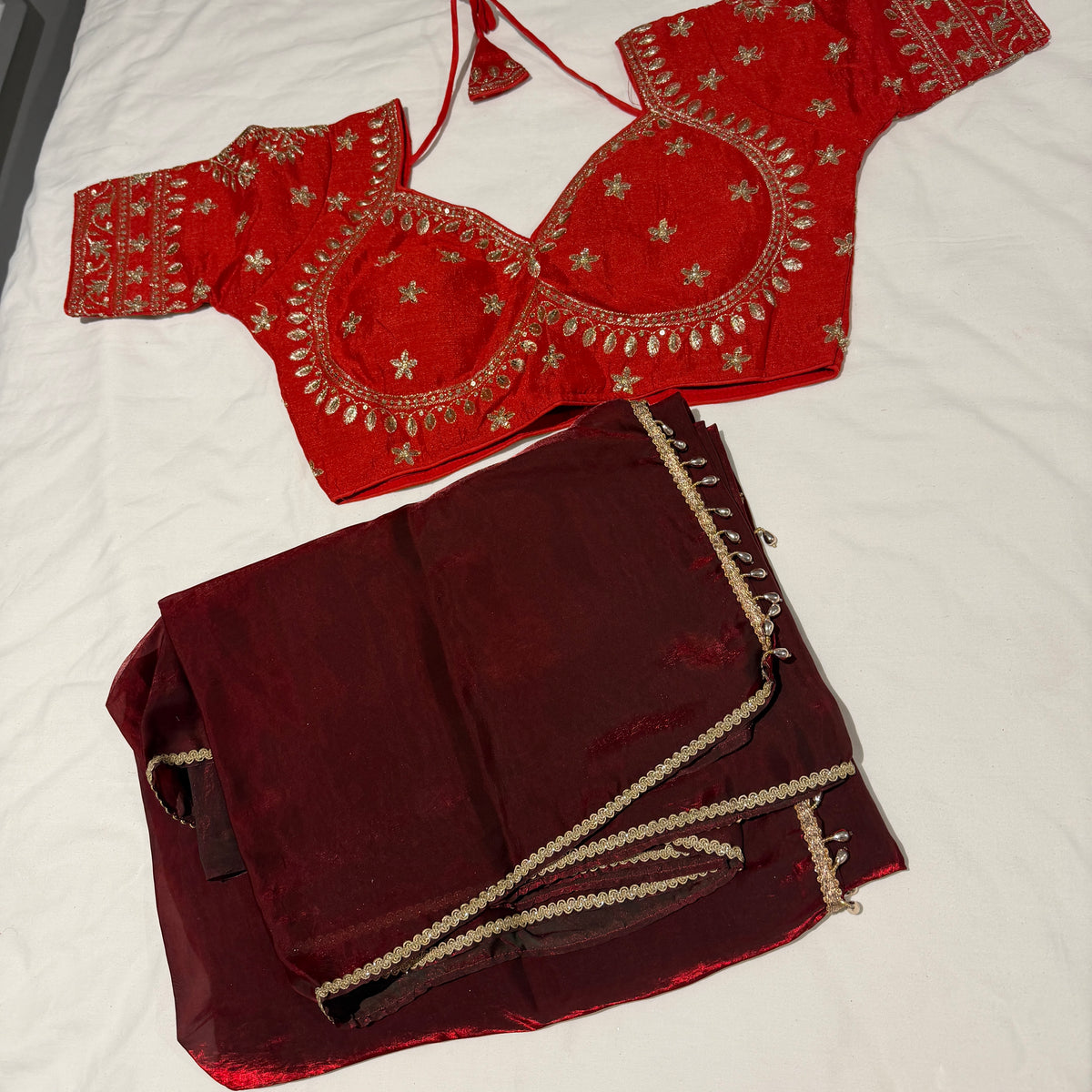 Maroon Shimmer Tissue Organza Saree with Heavy Embroidered Red Blouse Set